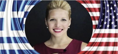 Smiling woman between Greek and American flags